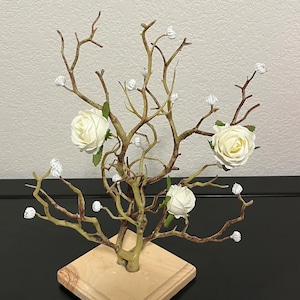 Handmade tree centerpiece with white flowers