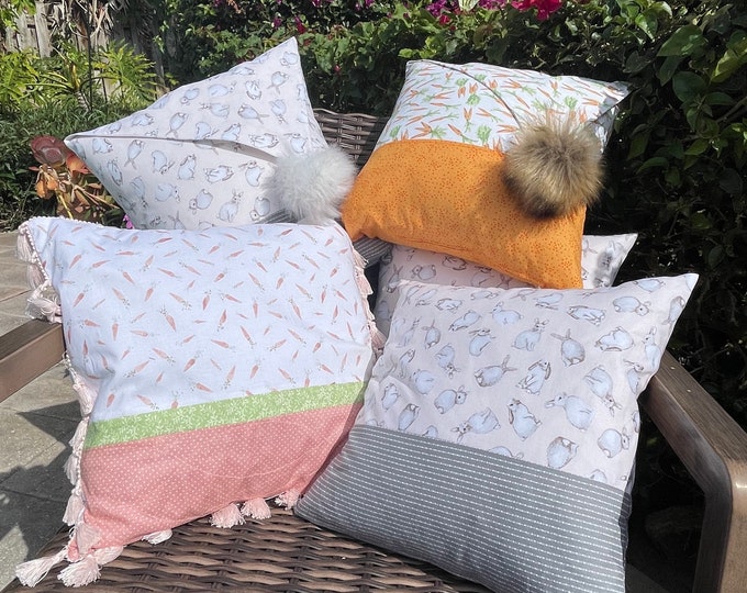 Easter pillow covers with fun poufs, decorative trim and removable pillow forms