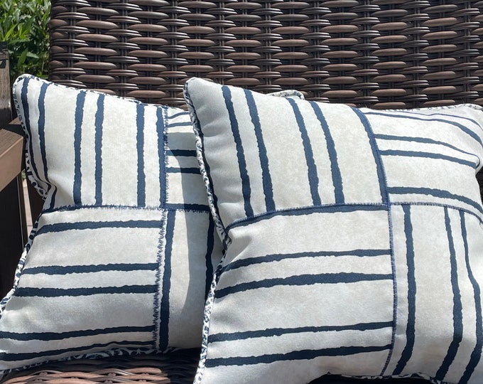 Outdoor navy and white strip accent pillows