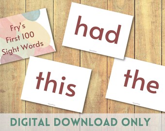 May include: Four white cards with red text on a wooden background. The cards have the words "Fry's First 100 Sight Words" on one card and "had", "this", and "the" on the other three cards.