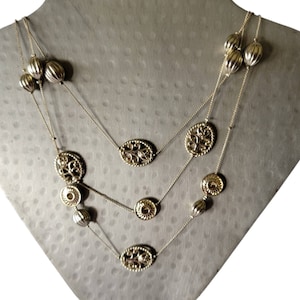 Triple Strand Gold Toned Floral Necklace Textured Oval Barrel Beads Small Floral Discs Beads Oval Floral Filigree Beads Vintage Necklace