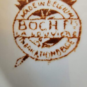 May include: A brown stamp with the text "Made in Belgium" and "Boch Fr&egrave;res La Louvi&egrave;re" in a circle.