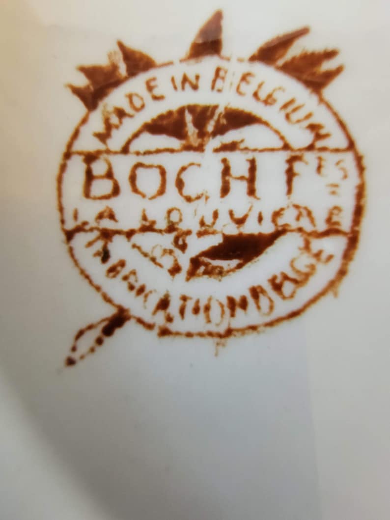 May include: A brown stamp with the text "Made in Belgium" and "Boch Fr&egrave;res La Louvi&egrave;re" in a circle.