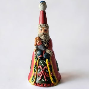 Vintage Price Products Old World Santa Claus Ceramic Bell Holding Doll Wearing A Christmas Gown Unique Collectible Christmas Holiday Decor