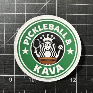 May include: A green and black circle sticker with the text "Pickleball & Kava" and a stylized image of a woman with a crown holding a pickleball paddle and a pickleball.