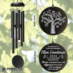 May include: Black wind chimes with a round, engraved plaque. The plaque features a tree design with words like "Educator" and "Mentor." The second plaque says "In Honor of Your Retirement" with a name, date, and school.