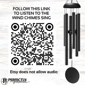 May include: Black wind chimes with a round top and multiple cylindrical tubes hanging below. The image includes a QR code and text that reads "FOLLOW THIS LINK TO LISTEN TO THE WIND CHIMES SING" and "Etsy does not allow audio."