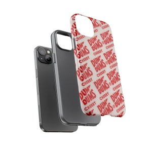May include: A white phone case with a repeating pattern of red "DUM DUMS CHERRY" text.