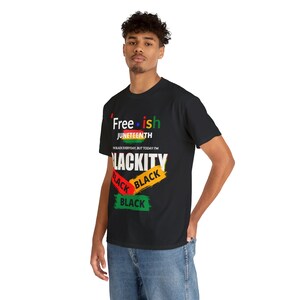 May include: Black t-shirt with the text "Free-ish Juneteenth" and "I'm Black Everyday But Today I'm Blackity Black Black" in colourful lettering.