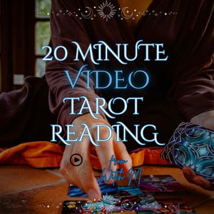 May include: A 20 minute video tarot reading service featuring a person in a brown robe holding a deck of cards with blue and black patterned backs, with several tarot cards laid out on a surface and text reading 20 MINUTE VIDEO TAROT READING.