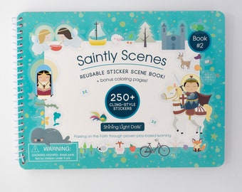 May include: A spiral-bound "Saintly Scenes" sticker scene book with a teal cover. The cover features illustrations of angels, a church, and a knight on a horse. The book includes over 250 cling-style stickers and bonus coloring pages.