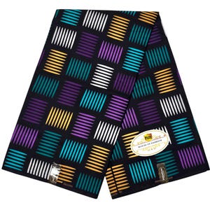 May include: A folded fabric with a geometric pattern of colorful rectangles on a black background. The rectangles are in white, yellow, teal, purple, and white. The fabric has a label that says "Pizzy One House of Fashion".