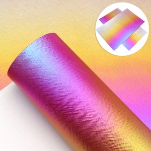 May include: A roll of iridescent pink and yellow faux leather with a textured surface. The leather has a gradient effect, transitioning from pink to yellow.