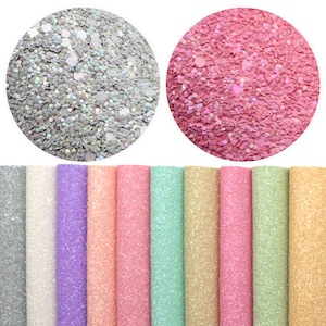 May include: Two circular glitter samples, silver and pink, are shown. Below, a row of rolled glitter sheets in various colours: silver, white, lavender, peach, pink, mint green, gold, and light gold. Ideal for crafting and decorations.