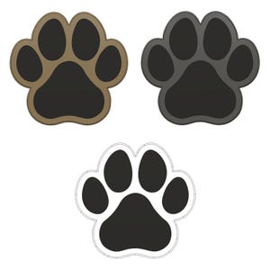 May include: Three paw prints in different colors: brown, gray, and black with a white outline. The paw prints are a simple design with four toes and a pad.