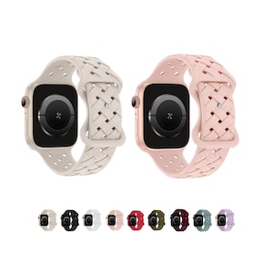 May include: Two Apple Watch bands in a braided design. The band on the left is beige and the band on the right is pink. Both bands have a woven pattern and are shown on a white background.