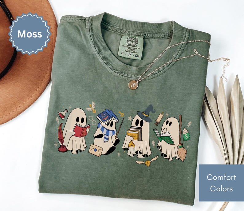 Halloween shirt featuring a cute reading ghosts dressed as wizard houses, perfect for spooky season. This wizard shirt doubles as a fun wizarding school tee or Halloween tee, ideal for Halloween matching, family trips, or Halloween group outfits with a magical twist.