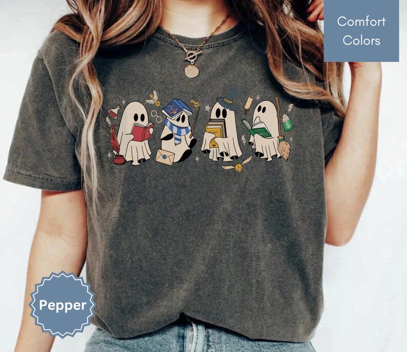 Halloween shirt featuring a cute reading ghosts dressed as wizard houses, perfect for spooky season. This wizard shirt doubles as a fun wizarding school tee or Halloween tee, ideal for Halloween matching, family trips, or Halloween group outfits with a magical twist.