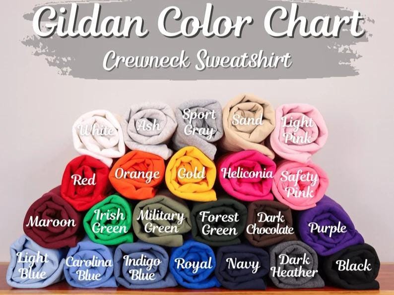 May include: A color chart for Gildan crewneck sweatshirts. The chart displays a variety of rolled-up fabric samples in colors such as white, red, orange, gold, and purple. The text "Gildan Color Chart Crewneck Sweatshirt" is at the top.