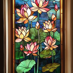May include: A stained glass window featuring pink and yellow water lilies with green leaves and stems set against a blue background.
