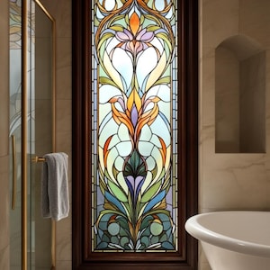 May include: A stained glass window with a floral design in a bathroom setting. The window features a variety of colors, including blue, orange, green, and yellow, set within a dark brown wooden frame. A matching floral design is on the floor.