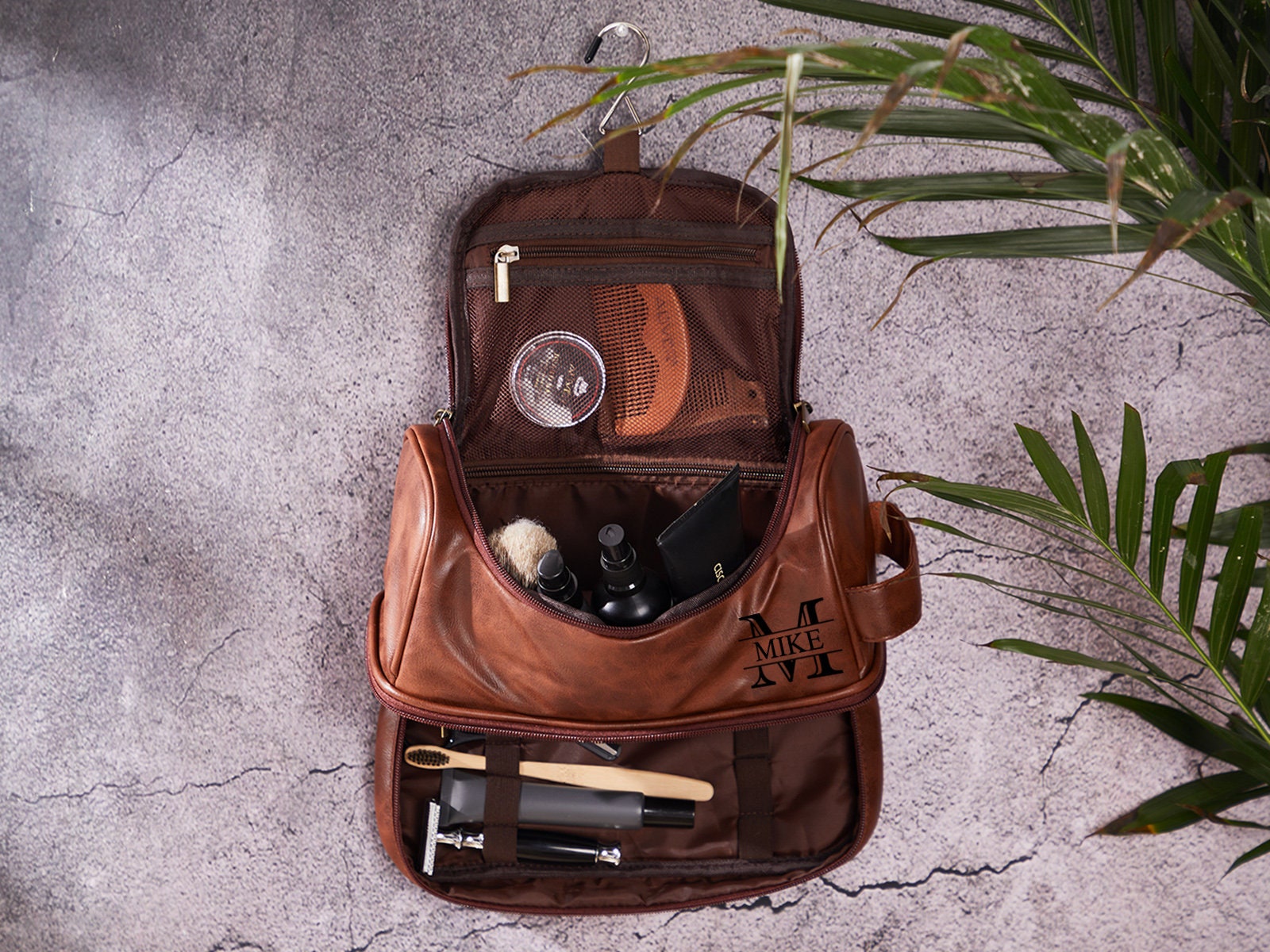 Mens Accessories With Dark Brown Leather Bags On Wooden Table Over