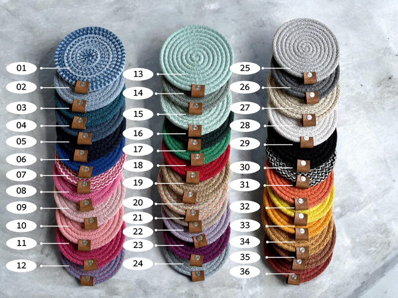 May include: Thirty-six round woven coasters in various colors, including blue, green, red, yellow, and brown. The coasters are stacked in columns of six, with numbers 1-36 printed on the left side of the image.