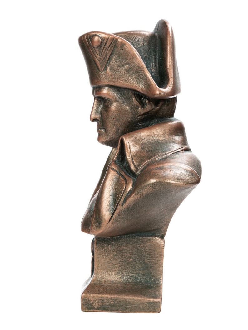 May include: A bronze bust of a man wearing a tri-cornered hat. The bust is on a square base.