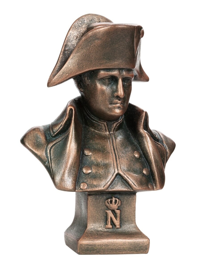 May include: A bronze bust of Napoleon Bonaparte wearing a bicorne hat. The bust is on a base with a crown and the letter "N" on it.