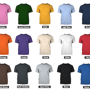 May include: A collection of short-sleeved t-shirts in various colors, including Azalea, Forest Green, Gold, Light Blue, Navy, Orange, Purple, Sand, White, Red, Dark Brown, Dark Heather, Sport Grey, Black, and Royal. Each shirt has a label with its color name.