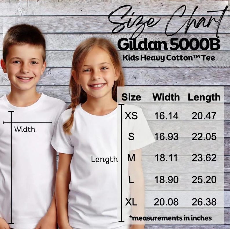 May include: Two children wearing white t-shirts stand in front of a wooden background. A size chart for Gildan 5000B Kids Heavy Cotton&trade; Tee is displayed, showing measurements in inches for sizes XS to XL. The chart includes width and length dimensions.