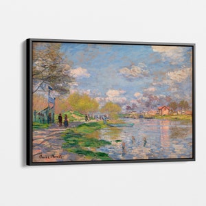 May include: A painting depicting a river scene with a blue sky, white clouds, and green trees. People are walking along the riverbank and a small red building can be seen in the distance. The painting is signed "Claude Monet" in the bottom right corner.