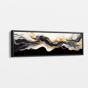 May include: Abstract art print with black, white, and gold flowing lines on a black background. The print is framed in a black frame.