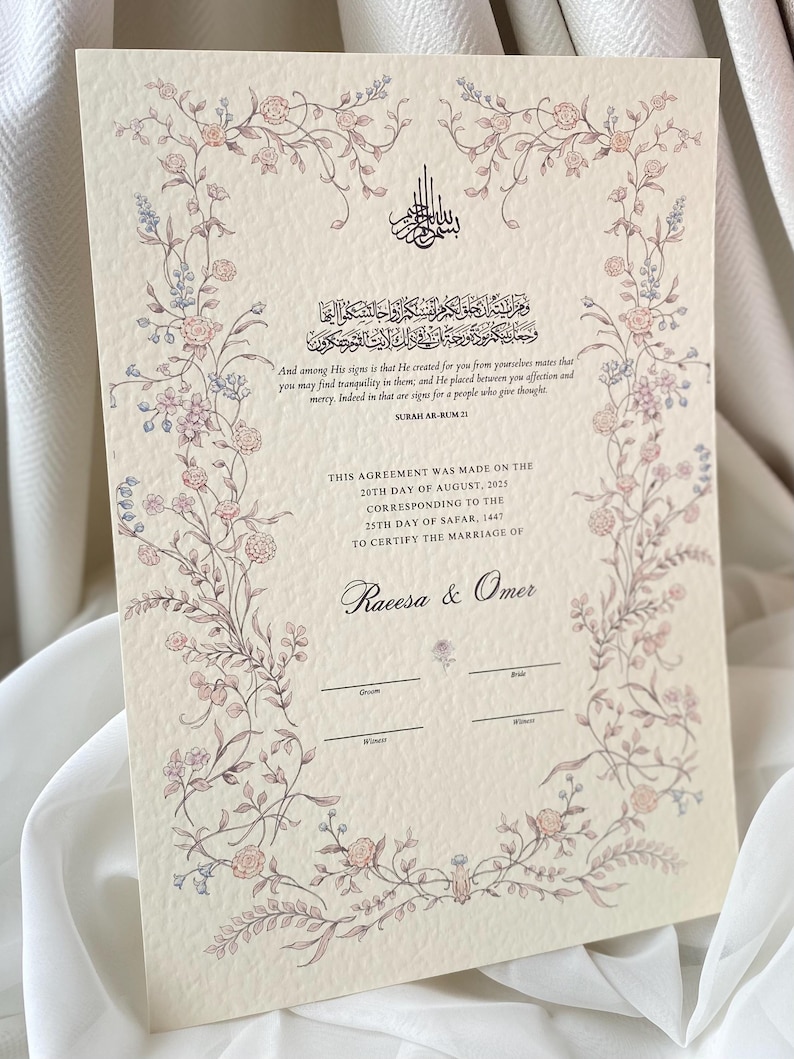 May include: A cream-coloured wedding certificate featuring a floral border in pink and blue. The document includes Arabic calligraphy and English text from Surah Ar-Rum 21, with spaces for names and dates. The certificate is for Raeesa & Omer.