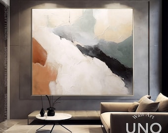 Puede incluir: Una gran pintura abstracta cuadrada con pinceladas gruesas y texturizadas en tonos crema, verde salvia suave, negro carbón profundo y terracota cálido. La obra está en un marco dorado fino e incluye el texto UNQ Wall Art Designs.