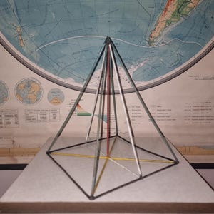 Vintage metal model of a geometric figure, shape. Industrial style