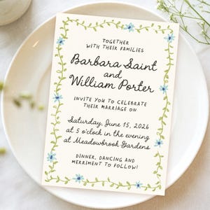 May include: A wedding invitation with a floral border in shades of green and blue. The invitation announces the marriage of Barbara Saint and William Porter on Saturday, June 15, 2026 at 5 o'clock in the evening at Meadowbrook Gardens.