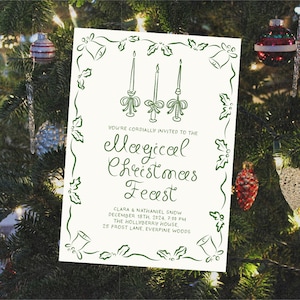 May include: A white Christmas invitation with a green border featuring a holly design. The invitation reads "You're cordially invited to the Magical Christmas Feast, Clara & Nathaniel Snow, December 18th, 2024, 7:00 PM, The Hollyberry House, 25 Frost Lane, Everpine Woods."