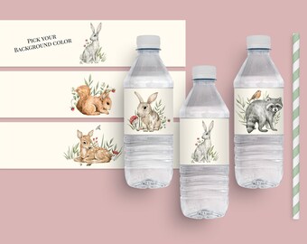 May include: Water bottle labels featuring woodland animals, including a rabbit, squirrel, deer, and raccoon. The labels are printed on white paper with a light brown background. The text "Pick Your Background Color" is printed on the top of the label.