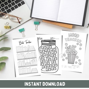 May include: Three printable black and white trackers for a book tracker, a money jar tracker, and a mood tracker. The book tracker has a bookshelf with spaces to write in the titles of books read. The money jar tracker has a jar with dollar bills inside and spaces to write in the month and total amount saved. The mood tracker has a popcorn bucket with spaces to color in the popcorn kernels to track mood.