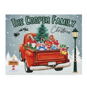 May include: A red pickup truck with a Christmas tree, presents, and candy canes in the bed. The truck is driving towards a streetlight and a sign that says "North Pole". The text "The Cooper Family Merry Christmas" is written on the image.