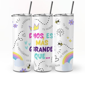 May include: Three white stainless steel tumblers with lids and straws. The tumblers are decorated with colorful designs and the text "Dios es mas grande que..."  The designs include hearts, stars, bees, a crown, a cross, and a rainbow.