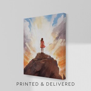 May include: A rectangular canvas print featuring a painting of a figure in a coral-colored dress standing atop a dark brown rocky cliff. The background displays a bright, glowing sky with white clouds and orange light rays emanating from behind.