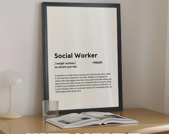 May include: A framed print with the definition of "Social Worker" in black text on a white background. The print is displayed on a light brown desk with an open book and a glass. The text "PRINTED & DELIVERED" is at the bottom.