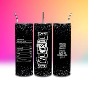 May include: A black glitter-covered tumbler with a silver straw. The tumbler features the text "Divemaster" in a license plate design, along with "Nutrition Facts" and the phrase "Because badass miracle worker isn't an official job title."