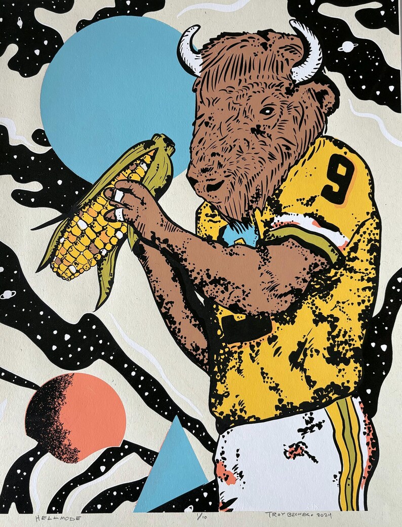 May include: A yellow and black football jersey with a brown buffalo head and horns. The buffalo is holding a large ear of corn. The background is a black and white abstract design with a blue and a red circle.
