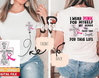 以下が含まれることがあります： 前面にピンクのリボンと十字架のデザインが施された白いTシャツ。Tシャツの背面には、「私は自分のためにピンクを着ます。私の傷跡は、私がこの人生のために戦ったことの証です。」というテキストが書かれています。