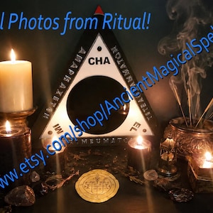 May include: A triangular black and white object with a central circular opening and the text "CHA" and "AMAPHAXITON" printed on it. The scene includes several lit candles, a metallic incense burner with rising smoke, and a circular gold-coloured seal.