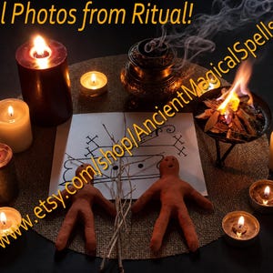 May include: Two brown clay humanoid figures are placed on a circular burlap mat alongside a white paper with black ink symbols, a small metal bowl with burning wood, and several lit candles. Text reads Real Photos from Ritual!