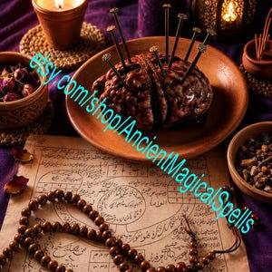 May include: A brown, textured, brain-shaped object sits on a round terracotta plate, pierced by several long, thin metal nails with textured heads. A string of dark brown wooden beads rests on a piece of aged parchment paper with handwritten text.